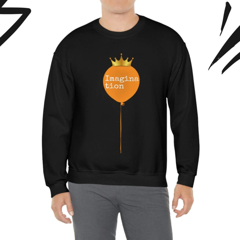 A model displays a sweatshirt with a unique balloon man illustration, emphasizing a fun and imaginative aesthetic.