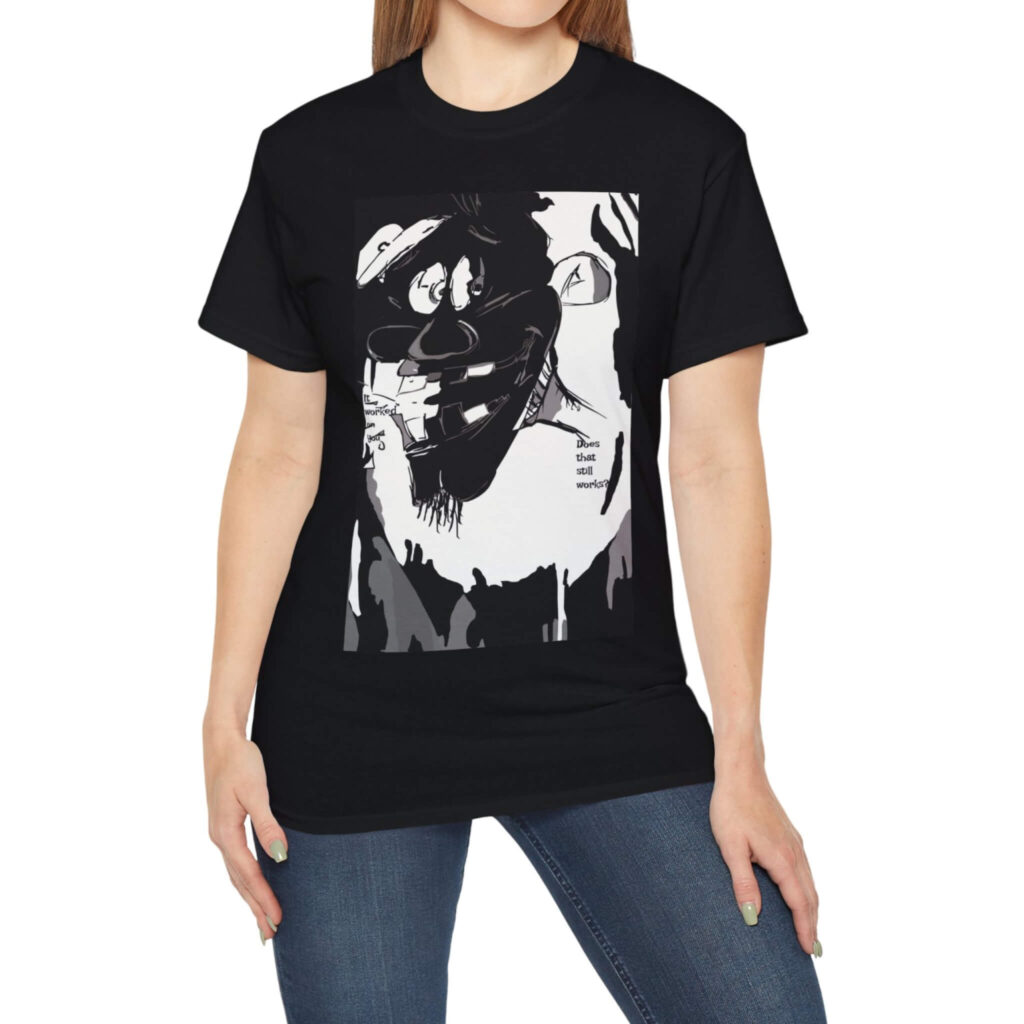 A woman sporting a black t-shirt adorned with a black and white portrait of a man, showcasing a relaxed and thoughtful pose.